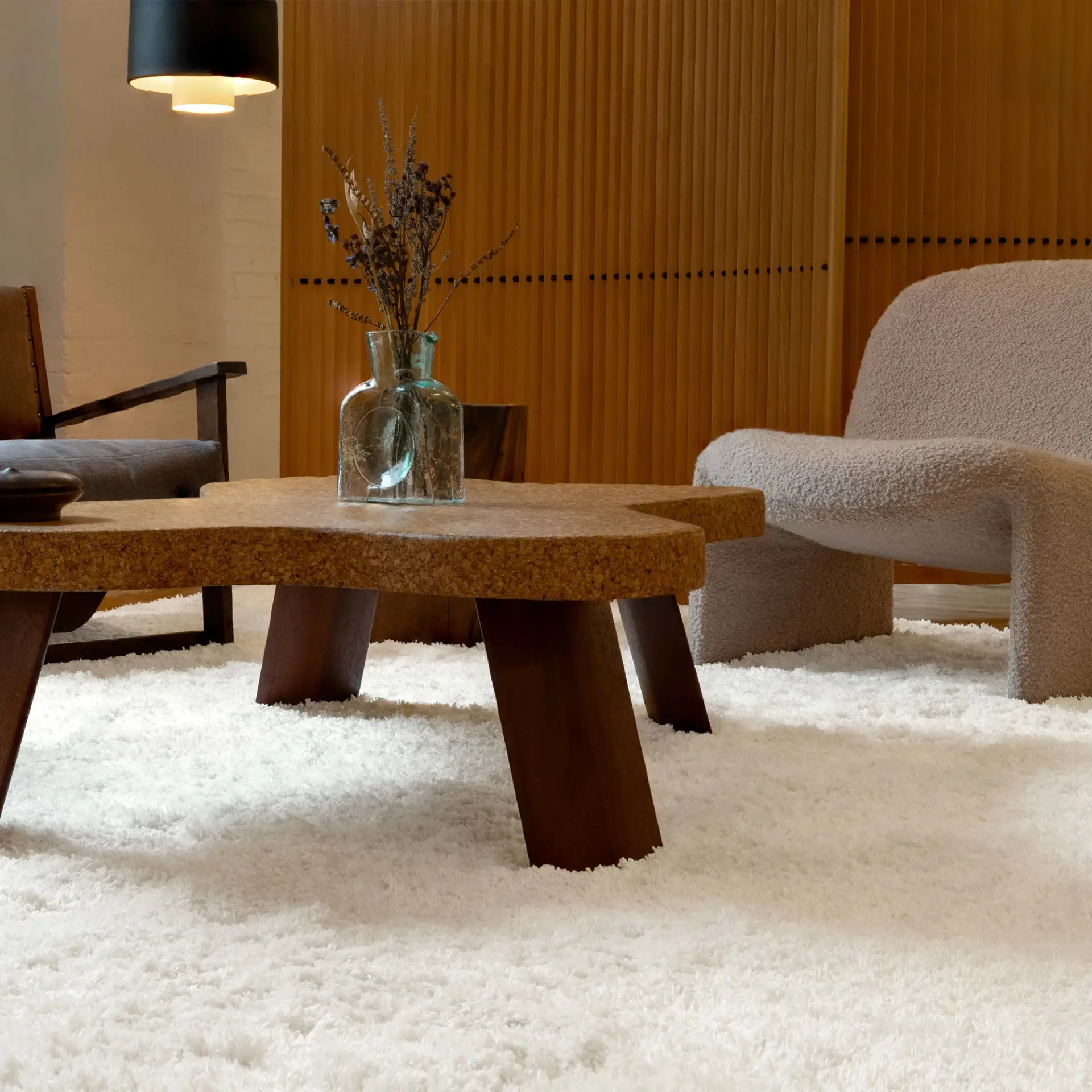 Textural shag rug anchoring a neutral living space