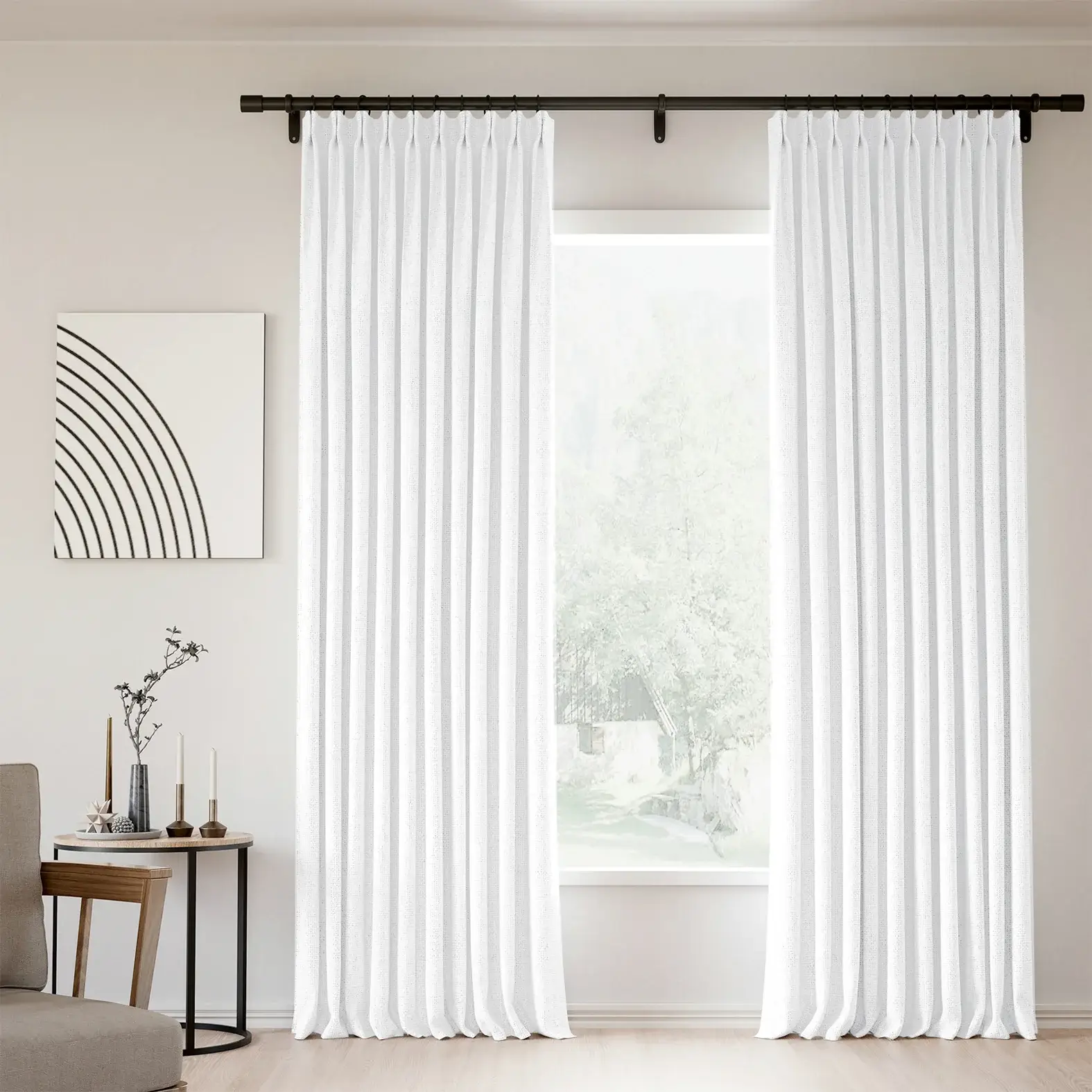 Pinch pleated linen blackout curtains in a bright bedroom